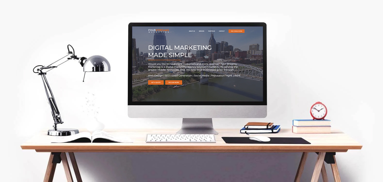 internet-marketing-gallatin-tn Desk featuring a desktop showing Four Streams Marketing on the screen
